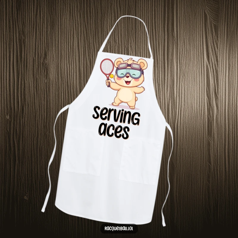 Funny apron featuring a giggling bear in oversized goggles, humorously serving a racquetball, perfect for the playful chef or kitchen enthusiast.