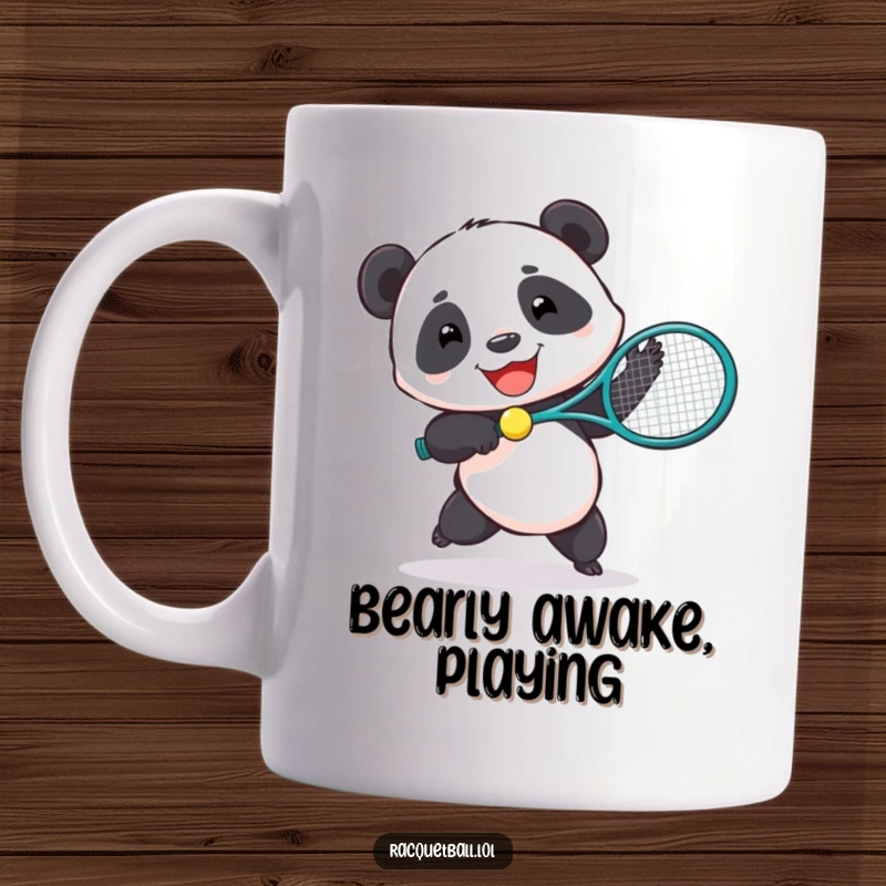 Funny mug with a joyful panda enthusiastically hitting a tiny ball with a comically large tennis racquet.