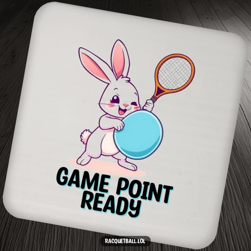 Funny Rabbit Coaster: A small coaster featuring a cartoon rabbit swinging a racquetboard, protecting surfaces with humor.