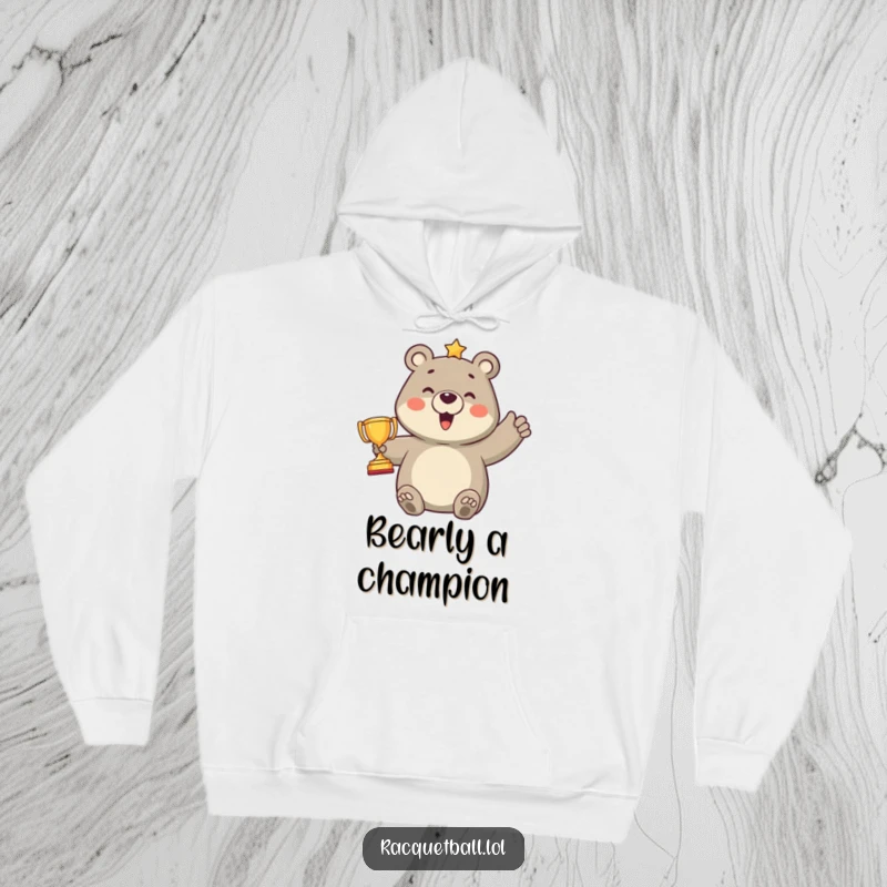 Funny hoodie showcasing a proud bear character gleefully celebrating a point with an adorably small trophy, perfect for sports enthusiasts and winners.