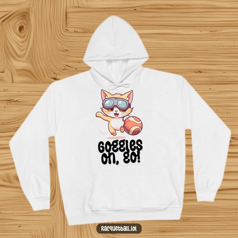 Funny hoodie featuring a cat with oversized goggles enthusiastically chasing a fast-moving ball, combining comfort and humor.