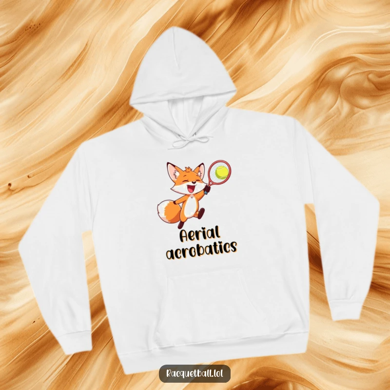 Funny fox hoodie, a joyful fox in mid-air, smashing a racquetball with energetic excitement.
