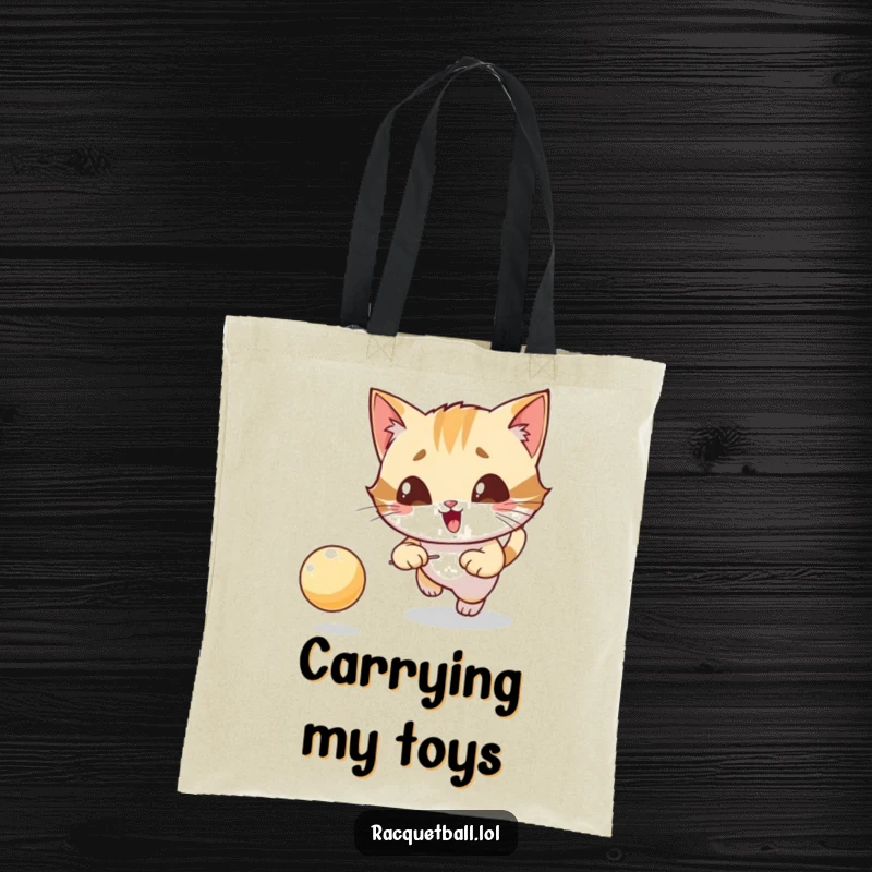 Funny tote bag showcasing a giggling cat character with extreme focus, chasing a bouncing ball, carrying capacity.