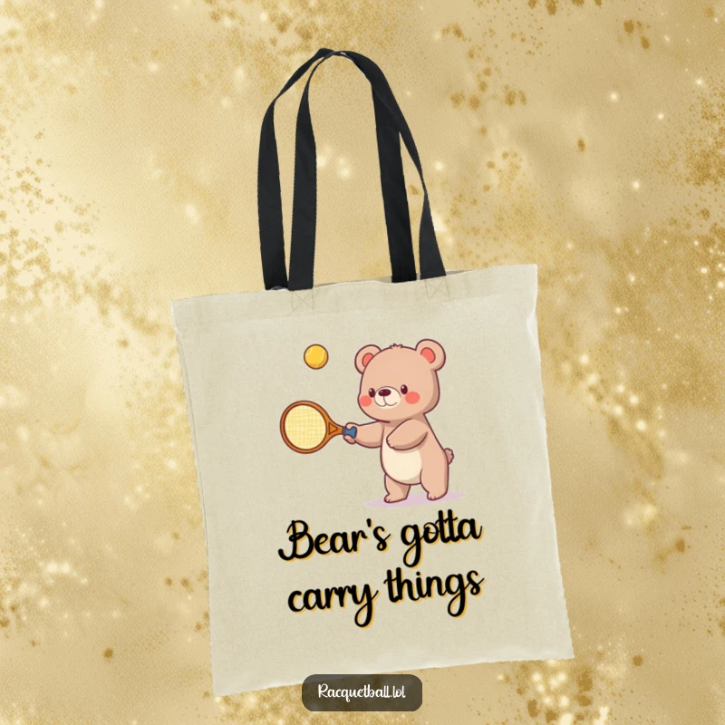 Funny tote bag illustration of a small bear enthusiastically wielding an oversized tennis racquet to bat a bouncing ball upwards, ready for the game.
