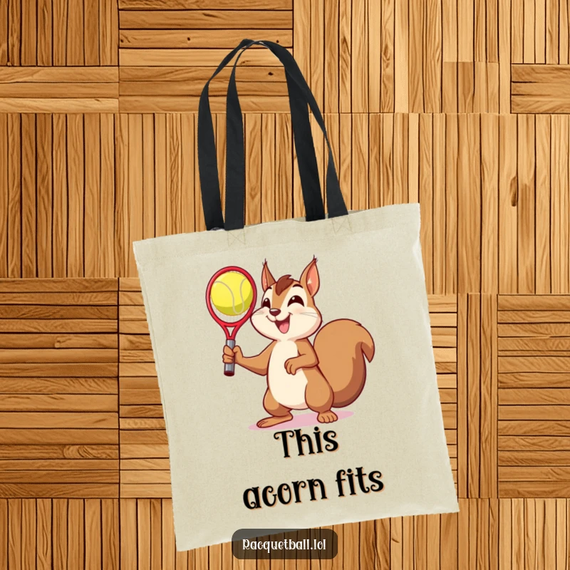 Funny tote bag depicting a squirrel striking a victory pose after catching a racquetball, a humorous and stylish accessory.